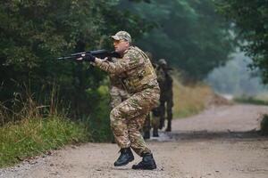 A disciplined and specialized military unit, donned in camouflage, strategically patrolling and maintaining control in a high-stakes environment, showcasing their precision, unity, and readiness for photo