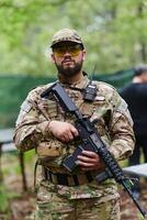 Elite soldier exudes focused determination and readiness, geared up for a perilous military operation, capturing the essence of courage and professionalism in the face of imminent danger photo