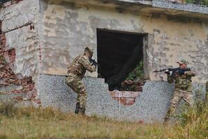 In a high stakes mission, a specialized military unit executes a tactical operation to secure a dangerous house where terrorists are believed to be hiding, showcasing precision and coordinated photo