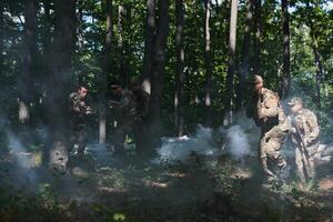 A specialized military antiterrorist unit conducts a covert operation in dense, hazardous woodland, demonstrating precision, discipline, and strategic readiness photo