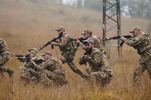 A disciplined and specialized military unit, donned in camouflage, strategically patrolling and maintaining control in a high-stakes environment, showcasing their precision, unity, and readiness for photo