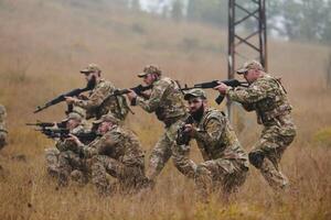 A disciplined and specialized military unit, donned in camouflage, strategically patrolling and maintaining control in a high-stakes environment, showcasing their precision, unity, and readiness for photo