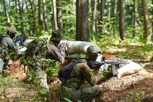 A disciplined and specialized military unit, donned in camouflage, strategically patrolling and maintaining control in a high-stakes environment, showcasing their precision, unity, and readiness for photo