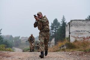 A disciplined and specialized military unit, donned in camouflage, strategically patrolling and maintaining control in a high-stakes environment, showcasing their precision, unity, and readiness for photo