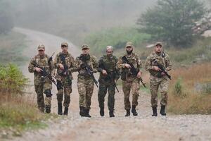 A disciplined and specialized military unit, donned in camouflage, strategically patrolling and maintaining control in a high-stakes environment, showcasing their precision, unity, and readiness for photo
