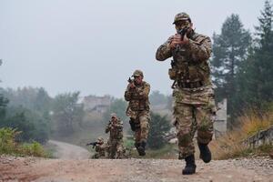 A disciplined and specialized military unit, donned in camouflage, strategically patrolling and maintaining control in a high-stakes environment, showcasing their precision, unity, and readiness for photo