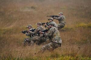 A disciplined and specialized military unit, donned in camouflage, strategically patrolling and maintaining control in a high-stakes environment, showcasing their precision, unity, and readiness for photo