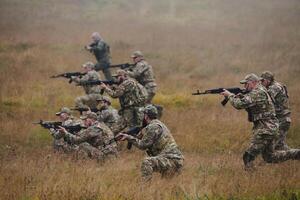 A disciplined and specialized military unit, donned in camouflage, strategically patrolling and maintaining control in a high-stakes environment, showcasing their precision, unity, and readiness for photo
