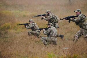 A disciplined and specialized military unit, donned in camouflage, strategically patrolling and maintaining control in a high-stakes environment, showcasing their precision, unity, and readiness for photo
