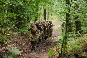 A disciplined and specialized military unit, donned in camouflage, strategically patrolling and maintaining control in a high-stakes environment, showcasing their precision, unity, and readiness for photo