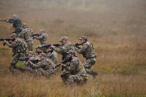A disciplined and specialized military unit, donned in camouflage, strategically patrolling and maintaining control in a high-stakes environment, showcasing their precision, unity, and readiness for photo