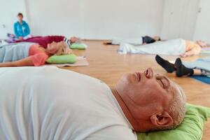 Senior Man Performing Neck and Back Exercises to Promote Healthy Aging and Well Being photo