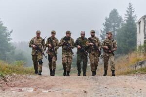 A disciplined and specialized military unit, donned in camouflage, strategically patrolling and maintaining control in a high-stakes environment, showcasing their precision, unity, and readiness for photo