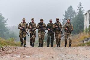 A disciplined and specialized military unit, donned in camouflage, strategically patrolling and maintaining control in a high-stakes environment, showcasing their precision, unity, and readiness for photo