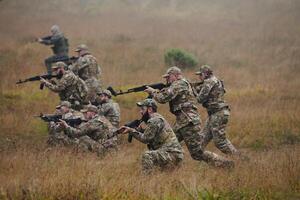 A disciplined and specialized military unit, donned in camouflage, strategically patrolling and maintaining control in a high-stakes environment, showcasing their precision, unity, and readiness for photo