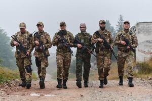 A disciplined and specialized military unit, donned in camouflage, strategically patrolling and maintaining control in a high-stakes environment, showcasing their precision, unity, and readiness for photo