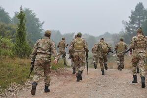 A disciplined and specialized military unit, donned in camouflage, strategically patrolling and maintaining control in a high-stakes environment, showcasing their precision, unity, and readiness for photo