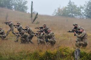 A disciplined and specialized military unit, donned in camouflage, strategically patrolling and maintaining control in a high-stakes environment, showcasing their precision, unity, and readiness for photo