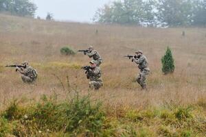 A disciplined and specialized military unit, donned in camouflage, strategically patrolling and maintaining control in a high-stakes environment, showcasing their precision, unity, and readiness for photo