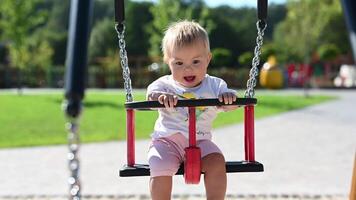 Happy Baby Girl On Swing Set video