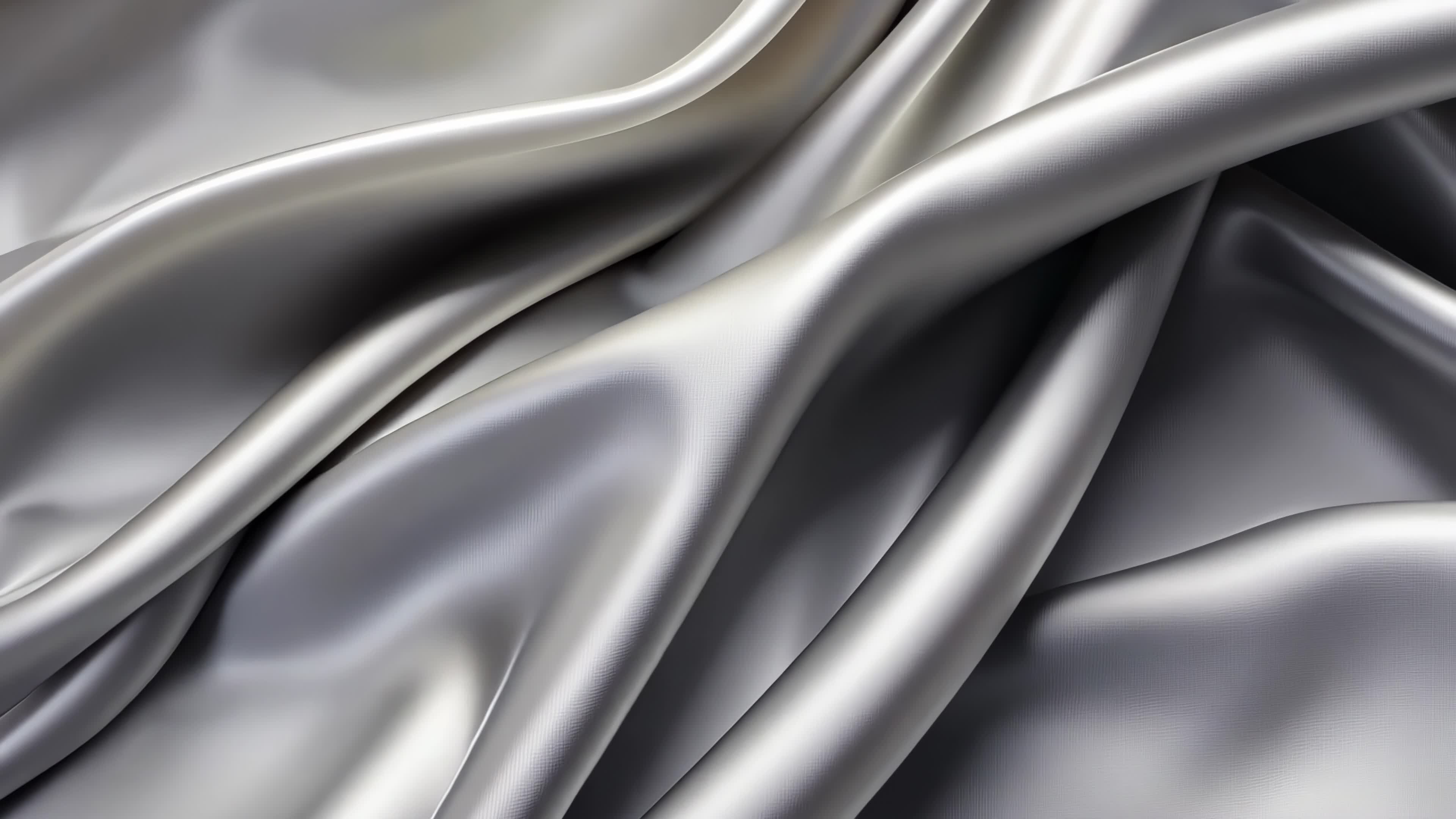 Dynamic flowing folds of silvery satin fabric, creating a visual