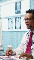 Vertical Doctor and patient discussing diagnostic results in a modern medical office, showcasing advanced healthcare technology using a screen displaying x rays and MRI scans. Care management. Camera B. video