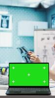 Vertical Physician discussing test results with a patient next to isolated mockup screen, presenting healthcare diagnosis during check up visit. Doctor discussing the treatment plan and advice. Camera B. video