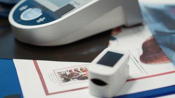 Professional and clean medical office awaiting a patient check up visit, equipped with oximeter, blood pressure monitor and diagnostic tools, emphasizing healthcare services and modern diagnostics. video