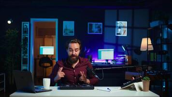 Artist filming DJ mixing tutorial, showing examples of sampling on sound controller to viewers. Viral online star showing modern musical equipment to subscribers in home studio, camera B video