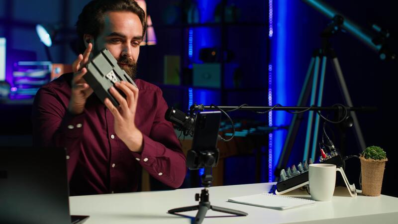 Tech Guru Presenting V Mount Battery Filming Technology Review Using Cellphone On Tripod And Tech Guru Presenting V Mount Battery Filming Technology Review Using Cellphone On Tripod And