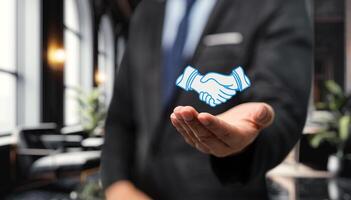 Two hands clasping, symbolizing partnership, collaboration, business investment, and teamwork photo