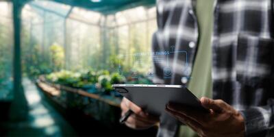 Smart Farm UI hologram system control, maintenance, displaying growth information Nutrients, fertilizers, water, insect pests of trees, plants, and vegetables, use technology in agriculture. photo