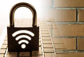 padlock with passwrod wi-fi with the computer keyboard with brick wall Internet security photo