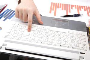 human hands on the notebook keyboard photo