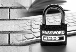 padlock with a computer keyboard with brick wall Internet security concept photo