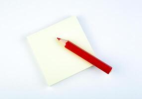 sheet of paper with red pencil photo