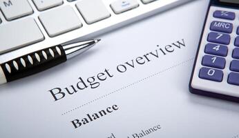 document with title budget overview and keyboard photo