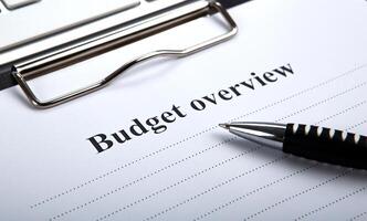 document with title budget overview and pen photo