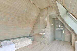 A bathroom with a sink and a bed in a room with a wooden ceiling photo