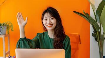 Cheerful Woman Waving During Call in Modern Corporate Office Setting photo