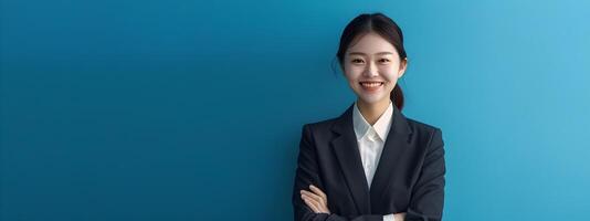Hallyu Businesswoman in Suit Smiling Confidently on Blue Commercial Background photo