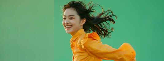 Lively Portrait of a Smiling Hallyu Woman Running with Modern Costume Against Green Background photo