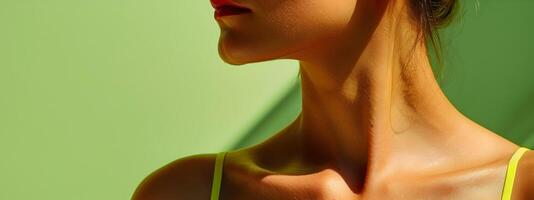 Close up shot of senior woman s shoulder in neo pop sensibility commercial style on light green background photo