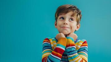 A young boy is looking up at the camera photo