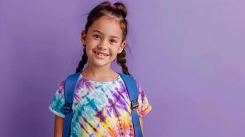 Smiling Young Student in Colorful Tie Dye Shirt Heading Back to School photo