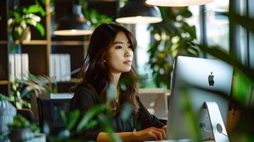 Portrait of Young Businesswoman Working on Computer in Startup Office Co Working Space photo