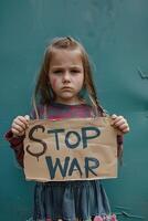 Sad Child Protester Holding Stop War Banner Against Turquoise Background photo