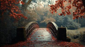 Enchanting Autumnal Bridge in Serene Forest Landscape with Colorful Falling Leaves photo