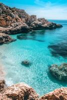 Breathtaking Turquoise Seascape with Dramatic Rocky Cliffs and Pristine Azure Waters photo