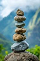 Perfectly Balanced Rock Cairn in Serene Mountain Landscape photo